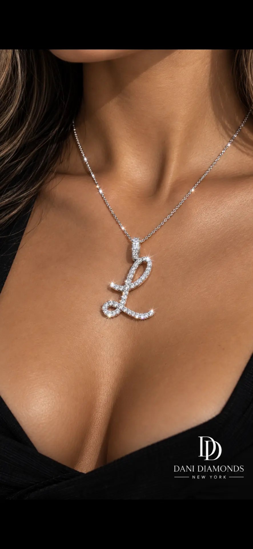 Custom diamond initial pendant worn on a fine chain