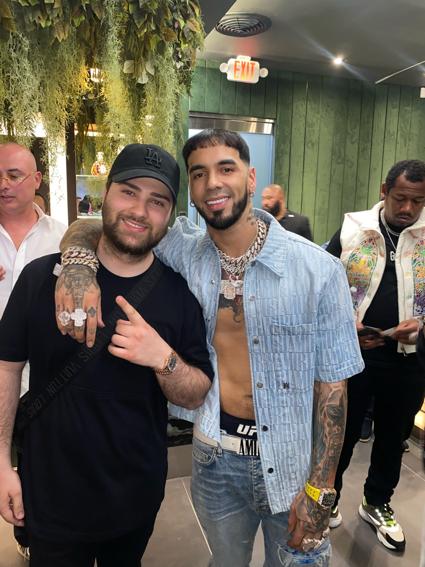 Dani with a client wearing custom jewelry at an event